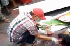 死亡事故現場で遺体の処理をする人